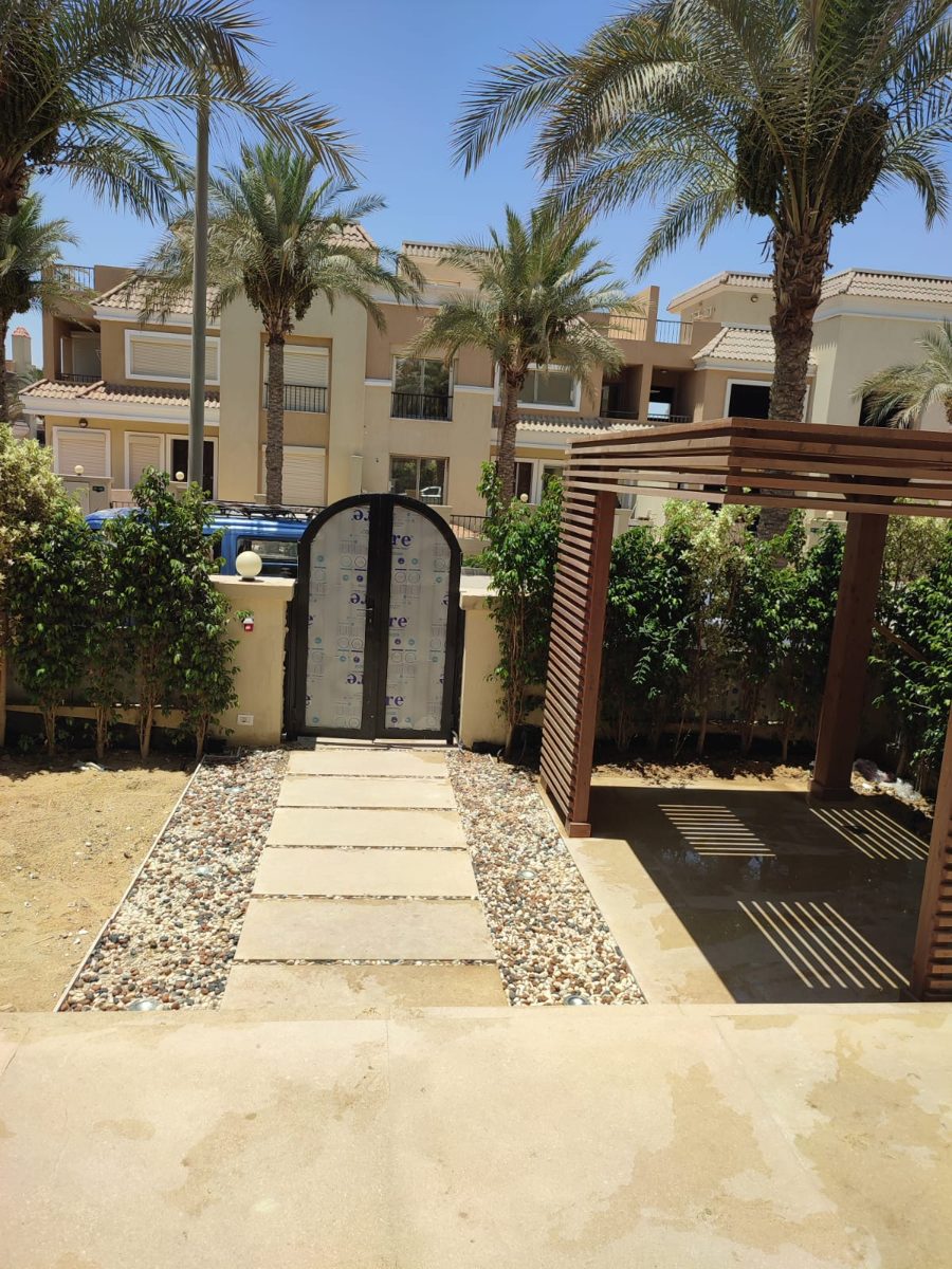 Garden entrance with pergola and stepping-stone path